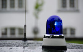blue police light shining on an old police car in Denmark